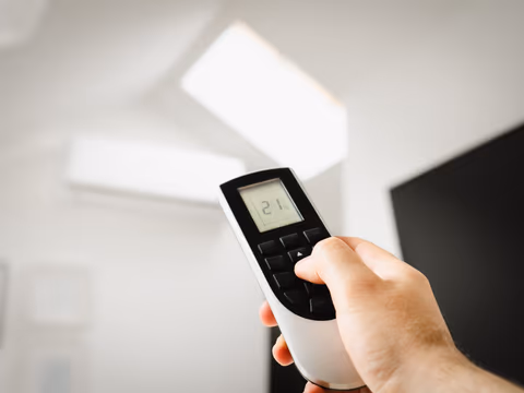 person controlling an ac